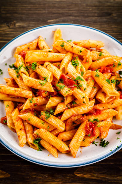 istock Penne with sauce and pork 961735642