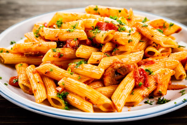istock Penne with sauce and pork 961735674