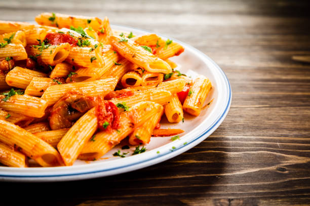 istock Penne with sauce and pork 961735694