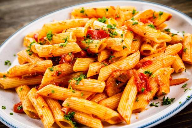 istock Penne with sauce and pork 961735740