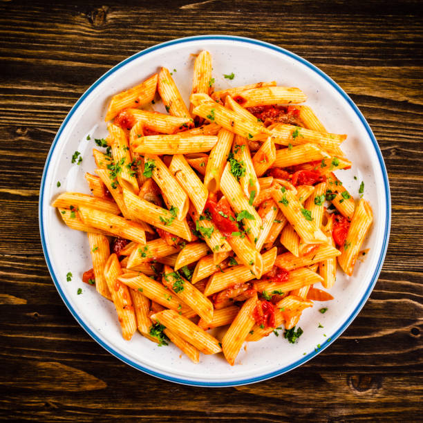 istock Penne with sauce and pork 961735768
