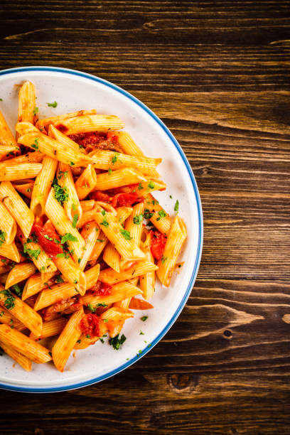 istock Penne with sauce and pork 961735792