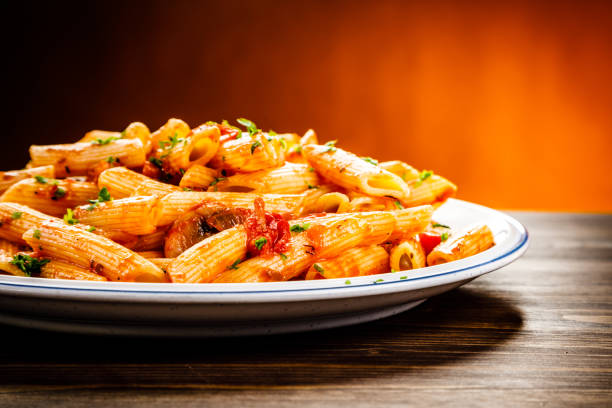 istock Penne with sauce and pork 961735800