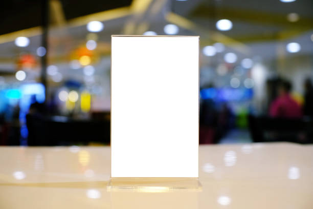 istock Mock up Menu frame standing on wood table in Bar restaurant cafe. space for text 961736160