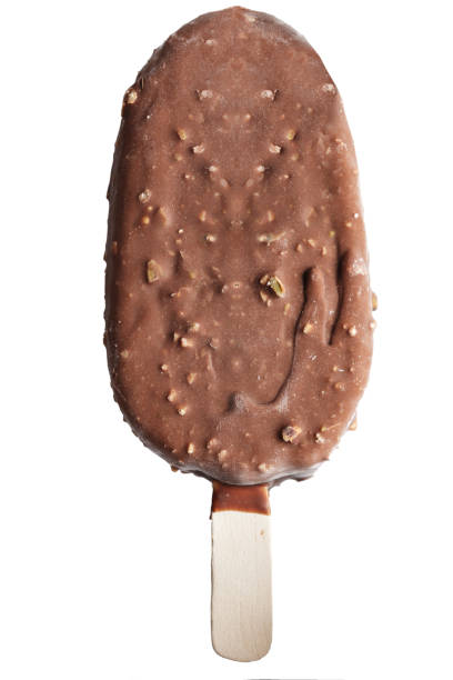 istock ice cream in chocolate with nuts on stick, isolated on white background. 961736664