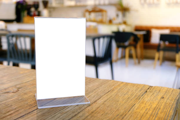 istock Mock up Menu frame standing on wood table in Bar restaurant cafe. space for text 961736962