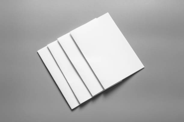istock Blank portrait mock-up paper. brochure magazine isolated on grey, changeable background / white paper isolated on grey 961738152