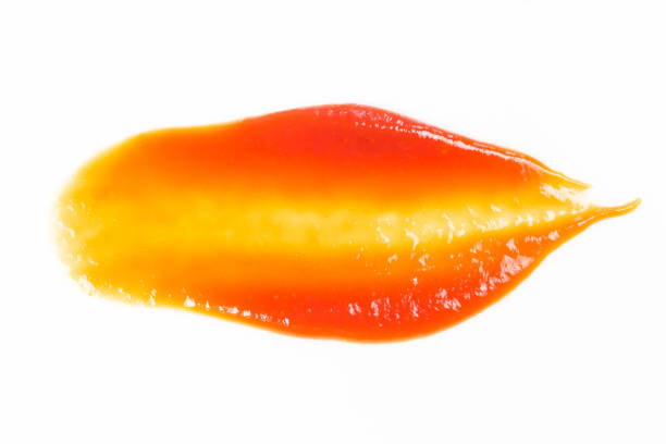 istock Tomato sauce isolated on white background. Red ketchup splashes isolated on white background, top view 961741556