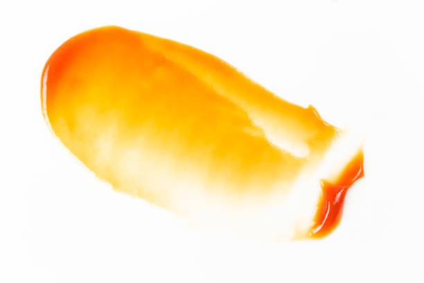 istock Tomato sauce isolated on white background. Red ketchup splashes isolated on white background, top view 961742464