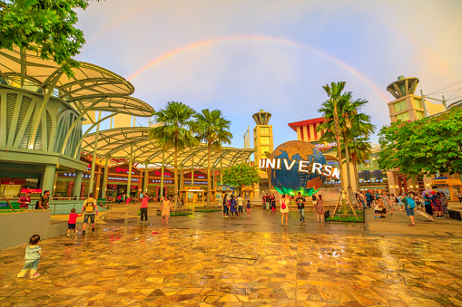 Singapore - May 2, 2018: Sentosa Bull Ring square with Universal Studios world globe in a rainbow at sunset. Famous place for holidays.Universal Studios is the first Hollywood movie theme park in Asia
