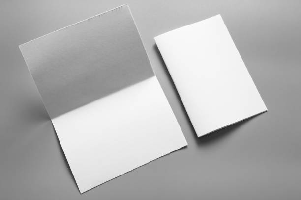 istock Blank portrait mock-up paper. brochure magazine isolated on grey, changeable background / white paper isolated on grey 961743040