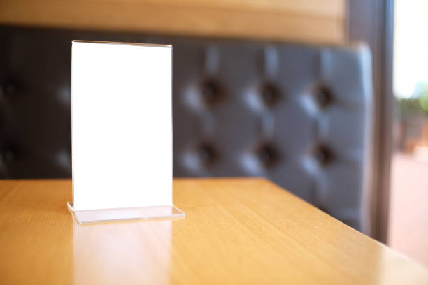 istock Mock up Menu frame standing on wood table in Bar restaurant cafe. space for text 961746026