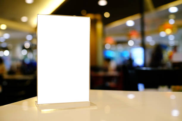 istock Mock up Menu frame standing on wood table in Bar restaurant cafe. space for text 961746140