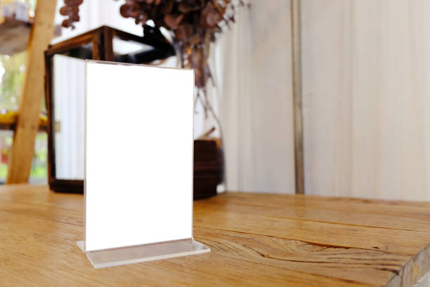 istock Mock up Menu frame standing on wood table in Bar restaurant cafe. space for text 961746666