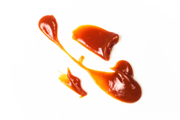 istock Tomato sauce isolated on white background. Red ketchup splashes isolated on white background, top view 961746710