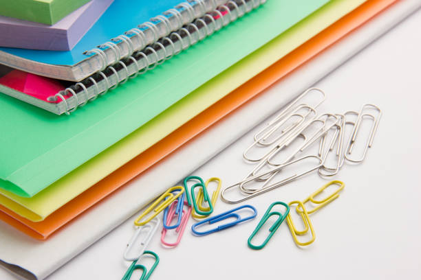 istock pencils paperclip notebooks notebooks on office desk 961749112