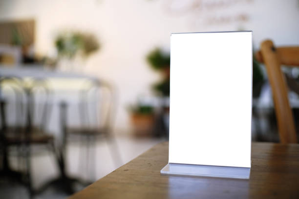 istock Menu frame standing on wood table in Bar restaurant cafe. space for text marketing promotion 961751420
