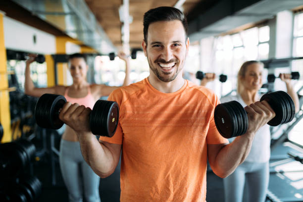 istock Determined male working out in gym 961751906