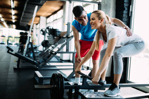 istock Personal trainer giving instructions in gym 961752342