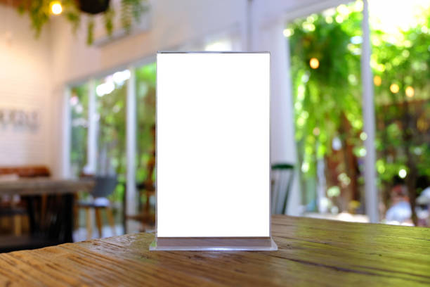 istock Mock up Menu frame standing on wood table in Bar restaurant cafe. space for text 961752652