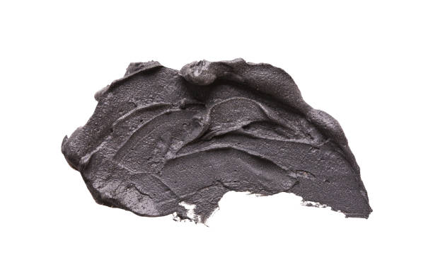 istock Black clay facial mask smear on white isolated background 961753908