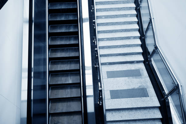 istock Modern escalator and staircase in subway station 961754806