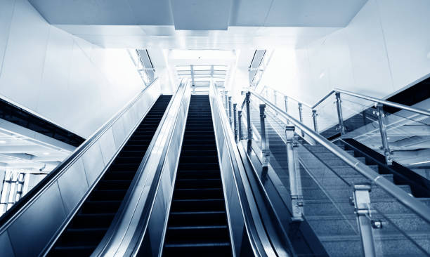 istock Modern escalator and staircase in subway station 961754812
