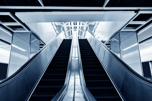 istock Modern escalator and staircase in subway station 961754890