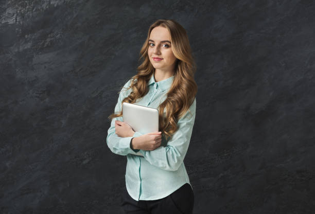 istock Elegant business woman with tablet, copy space 961757762