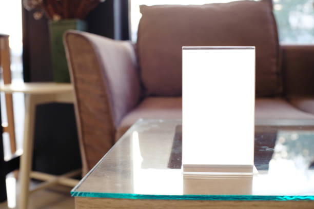 istock Mock up Menu frame standing on wood table in Bar restaurant cafe. space for text 961758632