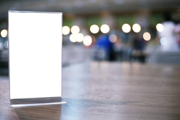 istock Menu frame standing on wood table in Bar restaurant cafe. space for text marketing promotion 961758726