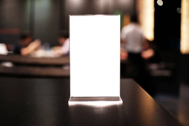 istock Menu frame standing on wood table in Bar restaurant cafe. space for text marketing promotion 961758784