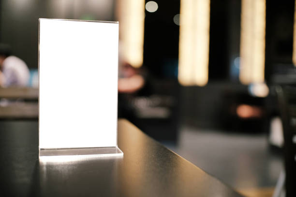 istock Menu frame standing on wood table in Bar restaurant cafe. space for text marketing promotion 961758788