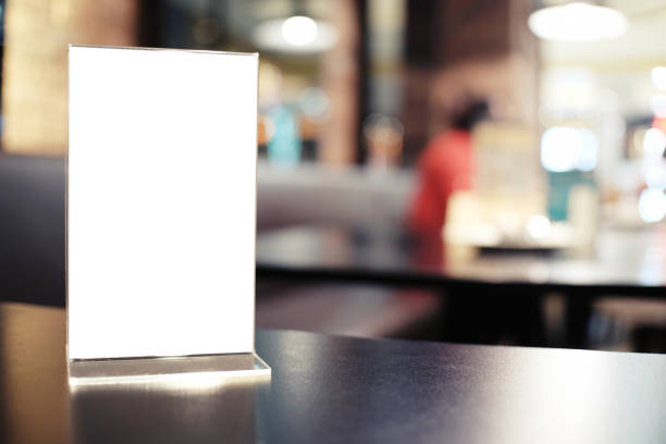 istock Menu frame standing on wood table in Bar restaurant cafe. space for text marketing promotion 961758808