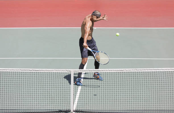 istock Backhand Stroke of a Shirtless Tennis Player 961759086