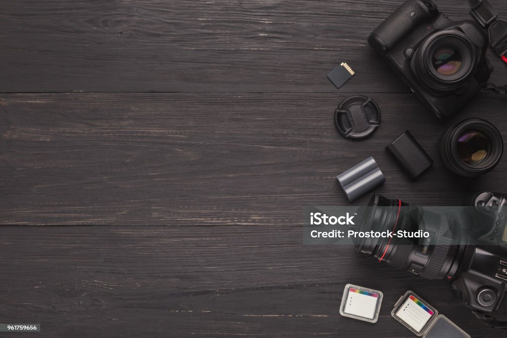 Diverse personal equipment for photographer Photo equipment frame. Top view of diverse personal equipment for photographer or creative designer, copy space Camera - Photographic Equipment Stock Photo