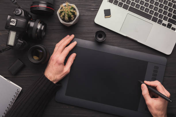 istock Designer hand with graphic tablet and keyboard 961759728