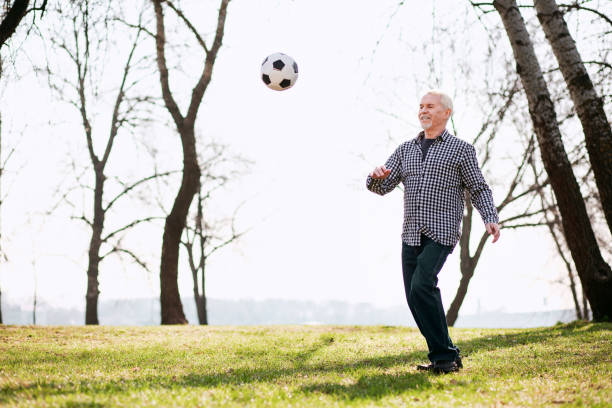istock Cheerful mature man catching ball 961760504