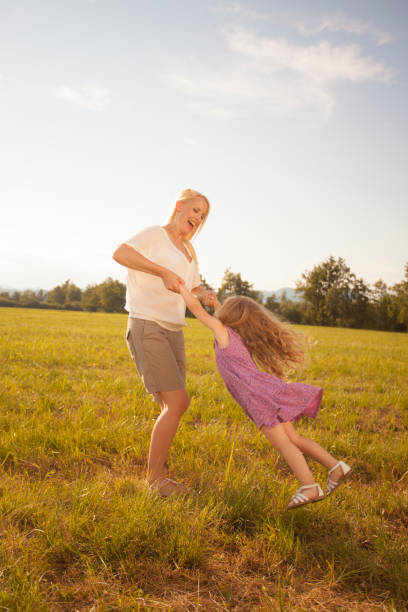 istock Spinning her daughter on a summer evening 961763750