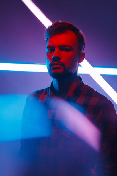 istock Handsome man near neon lights 961765138