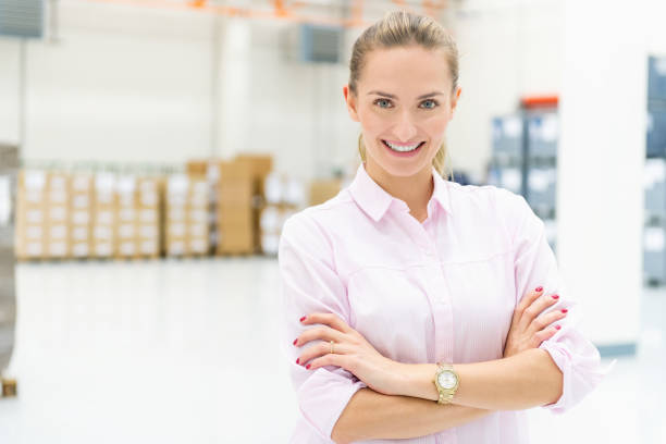 istock Businesswoman smiling at storage room 961772204