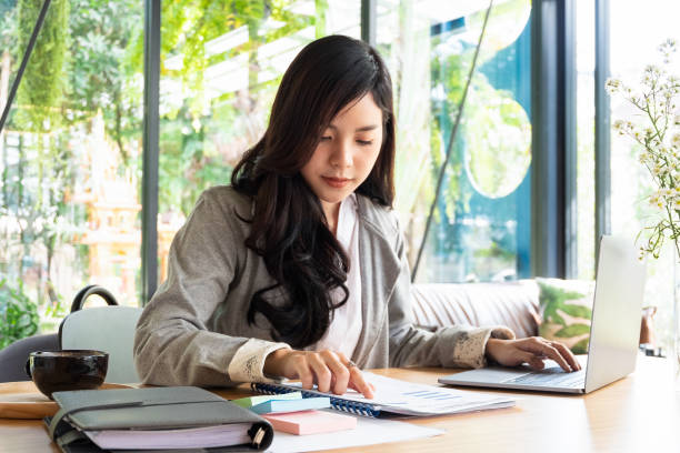 istock businesspeople working and discussing new plan project in office with document, business concept 961772528