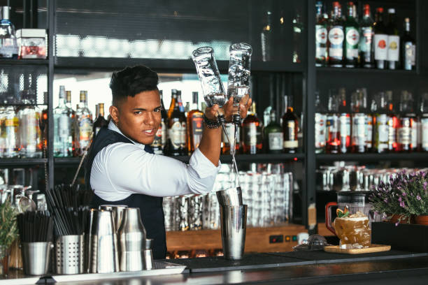 istock Expert barman adds alcohol to a shaker 961775960