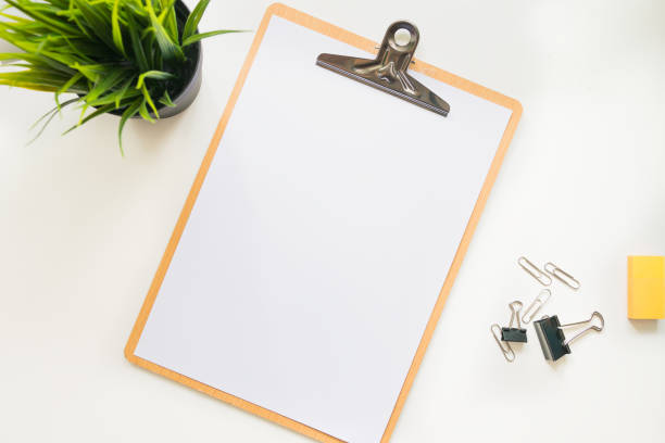 istock Top view of modern workspace office desk table with tablet and note page blank 961783334