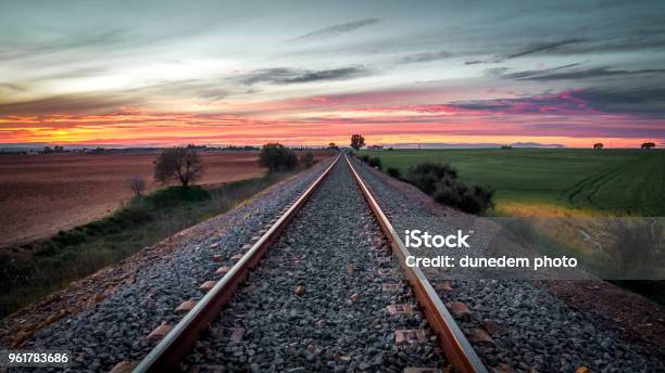 Train Tracks At Sunset Stock Photo - Download Image Now - Train - Vehicle, Road, Spain
