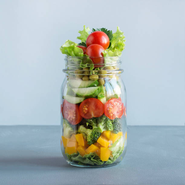 istock Vegetable salad in mason jar for eating in office. Square image. 961783696