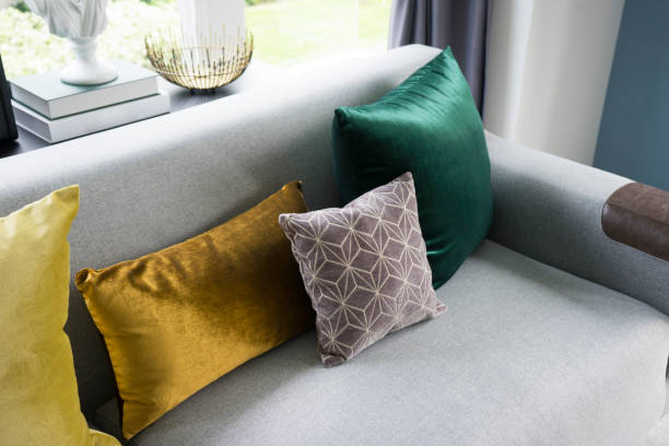 istock living room with grey sofa and colorful pillows 961785328