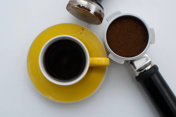 istock Black coffee in yellow cup with coffee equipments 961788894