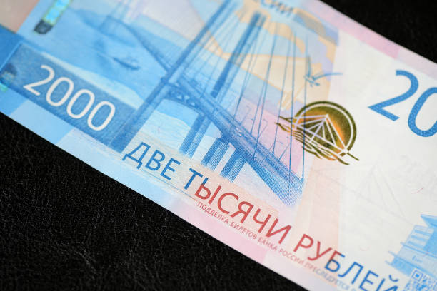 istock Russian banknote in two thousand rubles on a dark background close up 961789060