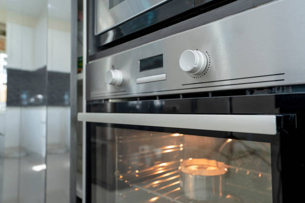 istock Microwave oven stainless steel in kitchen room modern home interior design cooking bread ready dinner food. 961794470